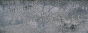 Abstrakter Hintergrund einer Wand, Zementstruktur, Effektfarbe in weiß und grau, Betonoptik. 